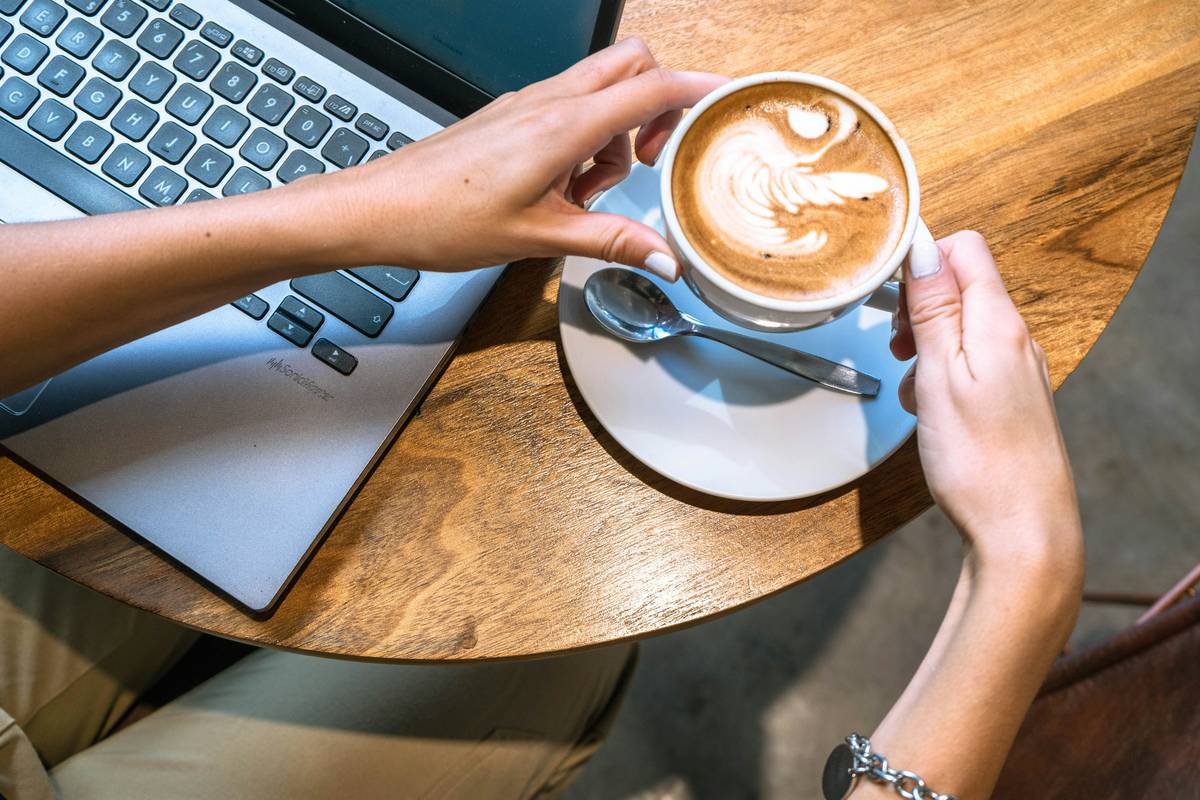 Remote worker setting up portable office for work remotely international travel