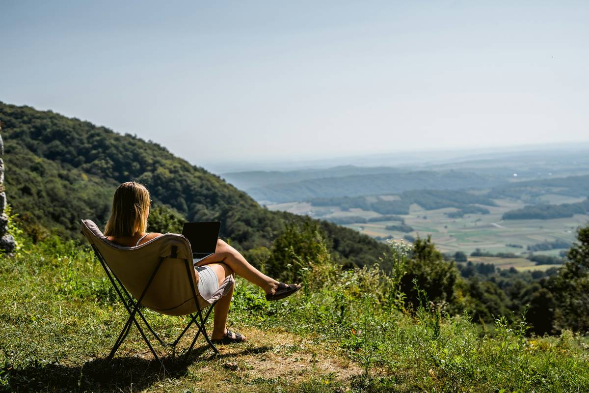 Solo traveler working remotely from a quiet cafe in Tbilisi, a top remote destination for solo travelers